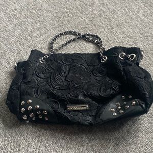 Beautiful black/ silver detail bag!!! Excellent used condition! Flower over lay!